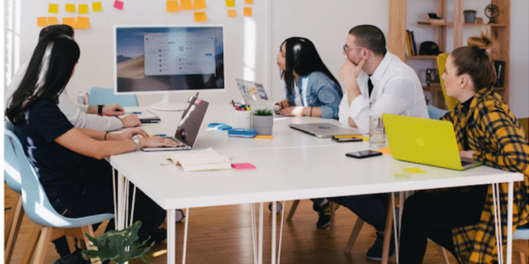 a team in an office researching cti during meeting