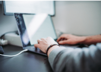 business employee using laptop for resource forecasting