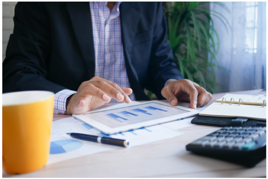 businessman using tablet for resource forecasting